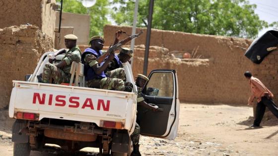 (FILES) In this file photograph taken on June 27, 2012, Burkinabe soldiers patrol in a pick-up car in Gorom-Gorom, northern Burkina Faso. - Suspected jihadists have massacred at least 114 civilians in Burkina Faso's volatile north in the deadliest attacks since Islamist violence erupted in the west African country in 2015, officials said June 5, 2021. (Photo by Issouf SANOGO / AFP)