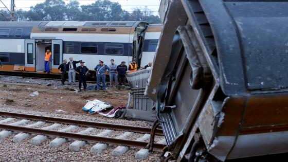 Security personnel stand at the site of a train derailment at Sidi Bouknadel near the Moroccan capital Rabat, Morocco October 16, 2018. REUTERS/Youssef Boudlal