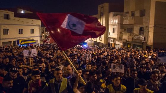 A protestor waves the flag of the Confederal Republic of the Tribes of the Rif which existed between 1921 and 1926 when the people of the Rif revolted and declared their independence from Spanish occupation as well as from the Moroccan sultan, during a march on May 31, 2017 in the northern Moroccan city of Al-Hoceima demanding the release of Nasser Zefzafi, head of the grassroots Al-Hirak al-Shaabi, or "Popular Movement". Thousands staged demonstrations for a fifth night running in northern Morocco to demand the release of the leader of a months-long protest movement in the neglected Rif region. The region has been shaken by social unrest since the death in October of fishmonger Mouhcine Fikri, 31, who was crushed in a rubbish truck in the fishing port of Al-Hoceima as he protested against the seizure of swordfish caught out of season. / AFP PHOTO / FADEL SENNA (Photo credit should read FADEL SENNA/AFP/Getty Images)