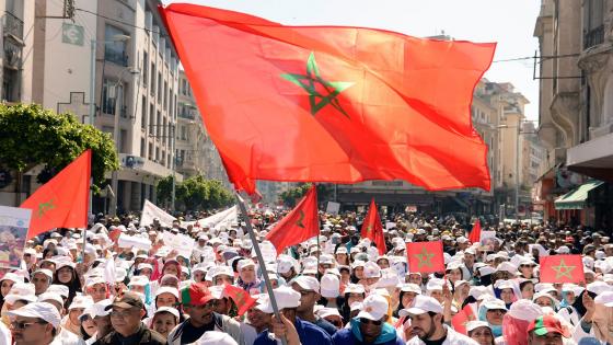 Protesters wave national flags during a demonstration gathering workers, teachers and civil servants against the deterioration in the social and economic conditions of the working class on April 6, 2014 in the Morrocan city of Casablanca. 8.000 people took part in the protest, organized by three leading labor unions. AFP PHOTO / FADEL SENNA (Photo credit should read FADEL SENNA/AFP/Getty Images)