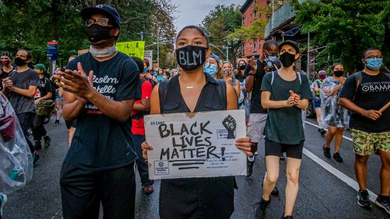 BROOKLYN, NEW YORK, UNITED STATES - 2020/08/28: A participant holding a Black Lives Matter sign at the protest. A coalition of activists and organizations led by activist, poet, and organizer Selu gathered across New York City. The coalition of NYC-based activists and organizations participated on a march through NYC in solidarity with the Get Your Knee Off Our Necks Commitment March on Washington to amplify the movement against police brutality and racial injustice. (Photo by Erik McGregor/LightRocket via Getty Images)